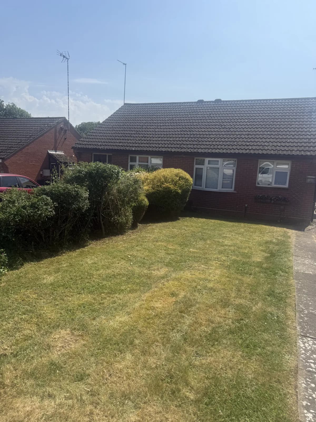 Maintained lawn and planting by Akromis
